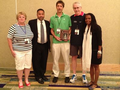 Director Steve and President Steve receive the associations Award, flanked by Associations Committee chair Karen Krsak, USATF CEO Max Siegel, and USATF President Stephanie Hightower (Bill Roe photo)